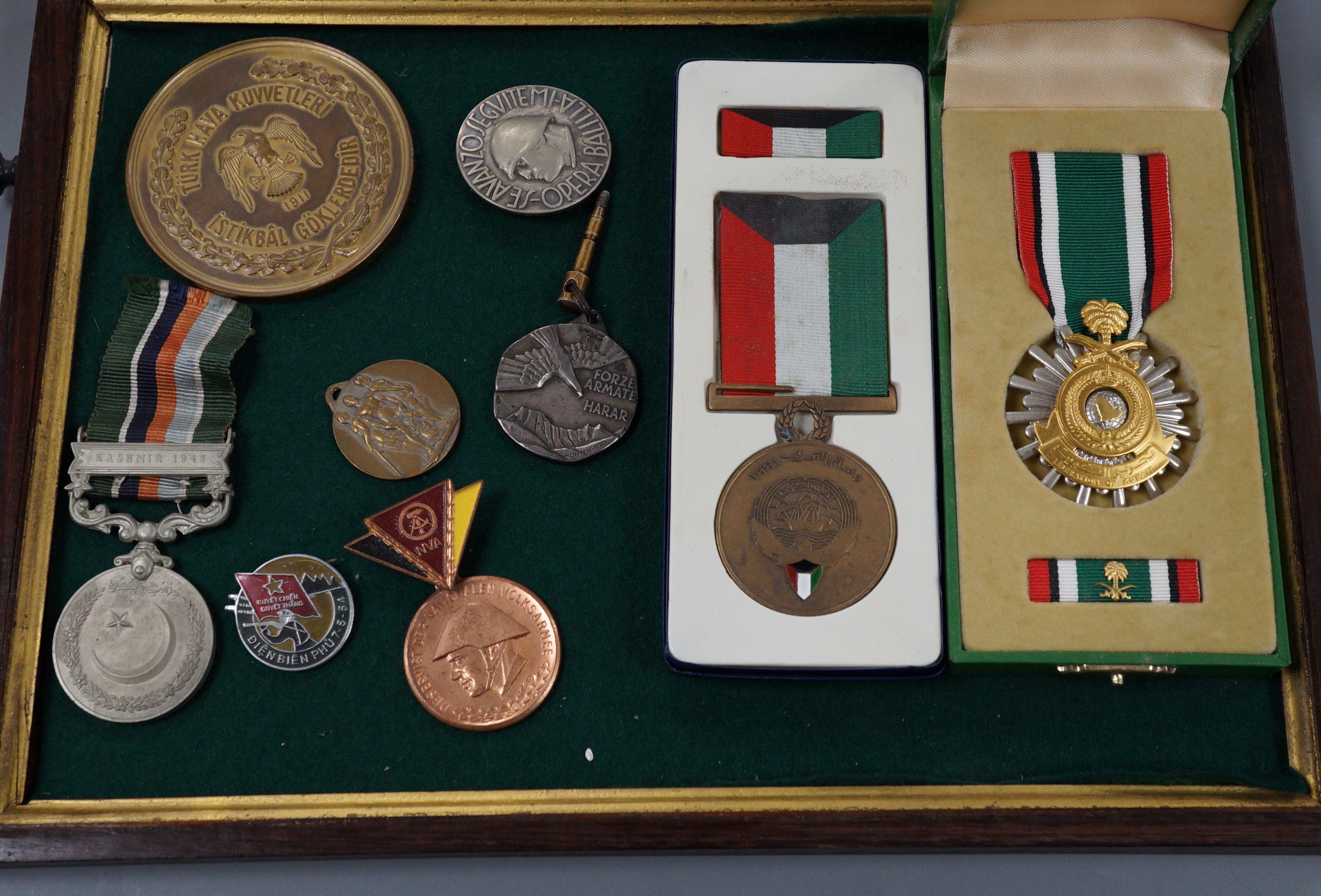 Foreign medals - Pakistan GSM with Kashmir 1948 clasp, two Liberation of Kuwait medals, Saudi Arabia and Kuwait issues, East German reserve medal, Italian Ethiopia Campaign 1937 medal, ONB badge and Combattimento medal,